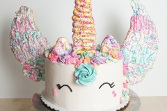 Unicorn - Chocolate Cake with Passion fruit Curd Filling and Vanilla Swiss Meringue Buttercream.