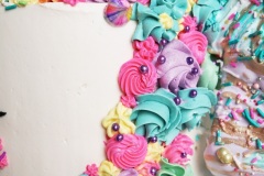 Unicorn - Chocolate Cake with Passion fruit Curd Filling and Vanilla Swiss Meringue Buttercream.
