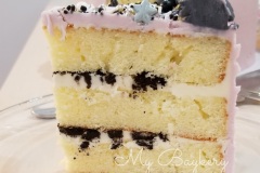 Vanilla Cake with Crushed Oreo in between layers.