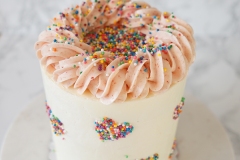Vanilla Cake  filled with fresh Strawberry slices and Strawberry Swiss Meringue Buttercream