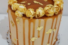 Caramel Cake with Caramel Buttercream and Caramel Drizzle. Topped with Caramel Popcorn and edible Gold Flakes.