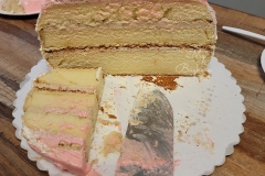 Longevity Peach Cake - Vanilla Cake with Coffee Swiss Meringue Buttercream. Leaves are made with marshmallow fondant. Peach Buns in the front