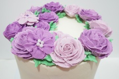 Vanilla Cake filled with Red Bean Whipped Cream. Covered in Vanilla Swiss Meringue Buttercream. Decorated with Frozen Swiss Meringue Buttercream Flowers